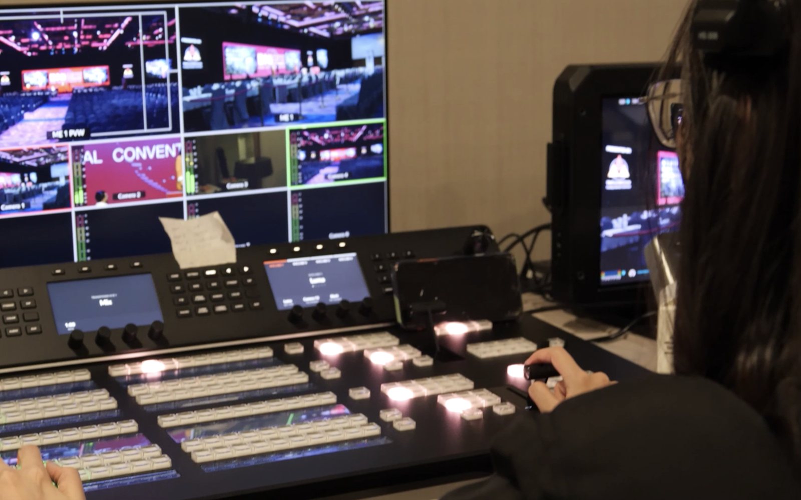 Vision mixing a live convention: switcher, programme monitor and camera feeds