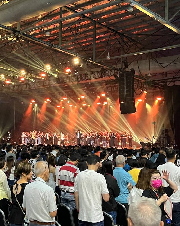 Stage lighting, line-array speakers and a full hall on its feet for a live performance