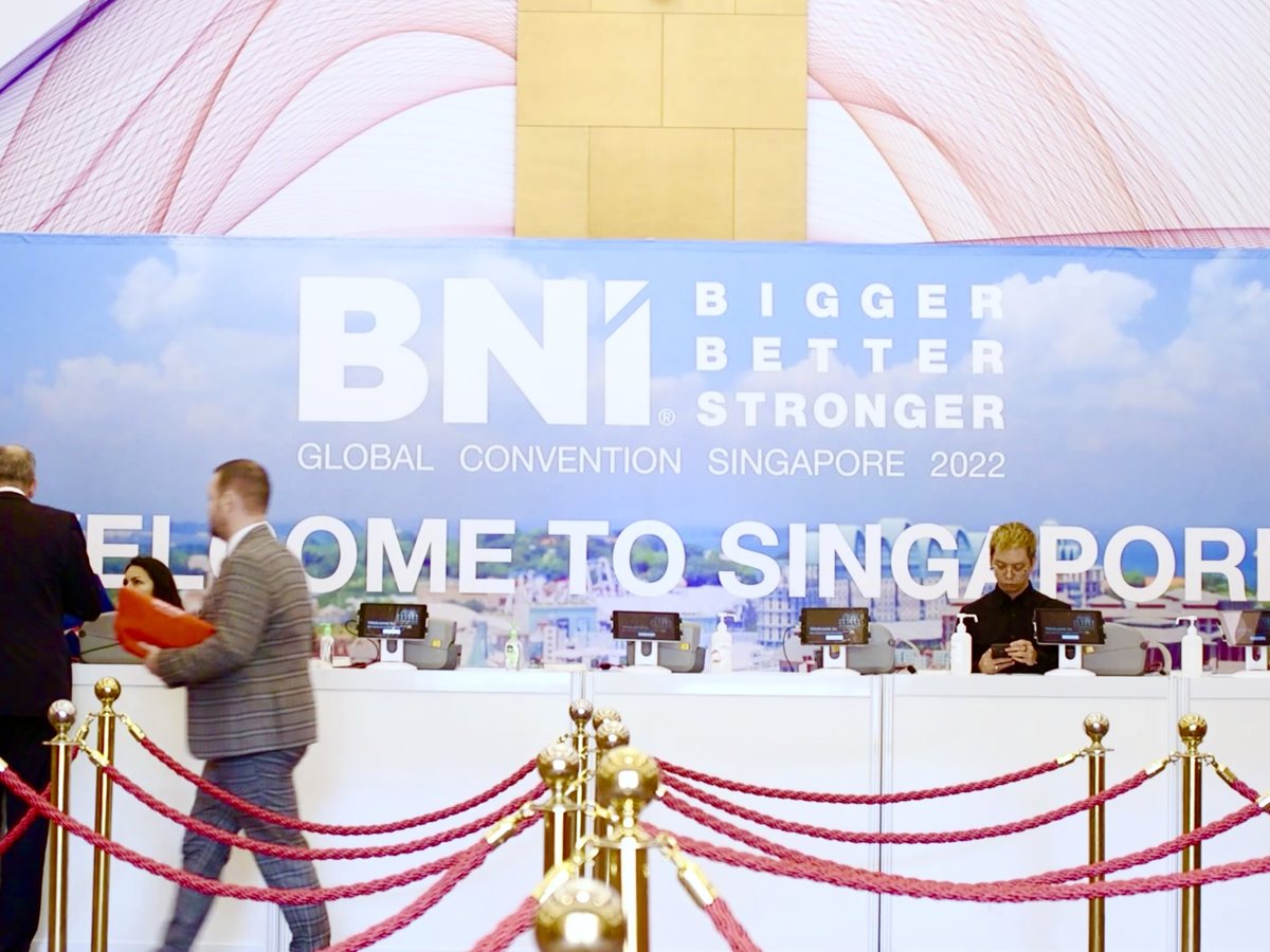 Delegates checking in at a convention registration counter