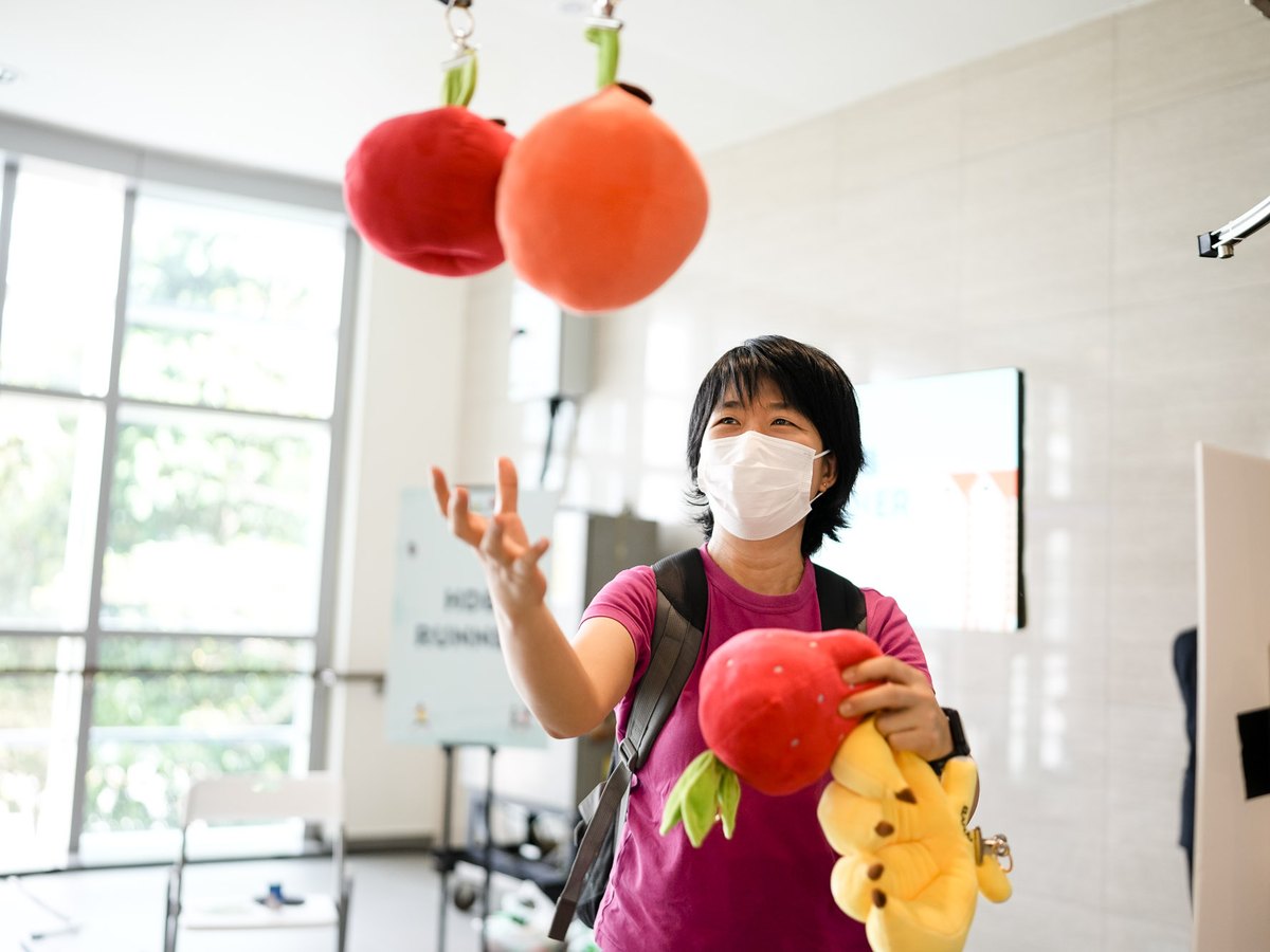 A visitor taking part in a hands-on activity station