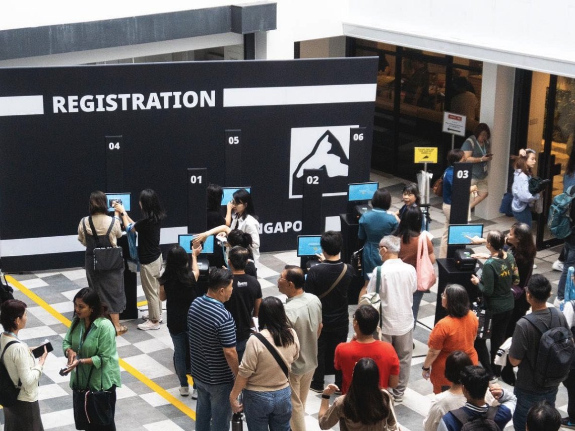 Guests queuing at registration counters